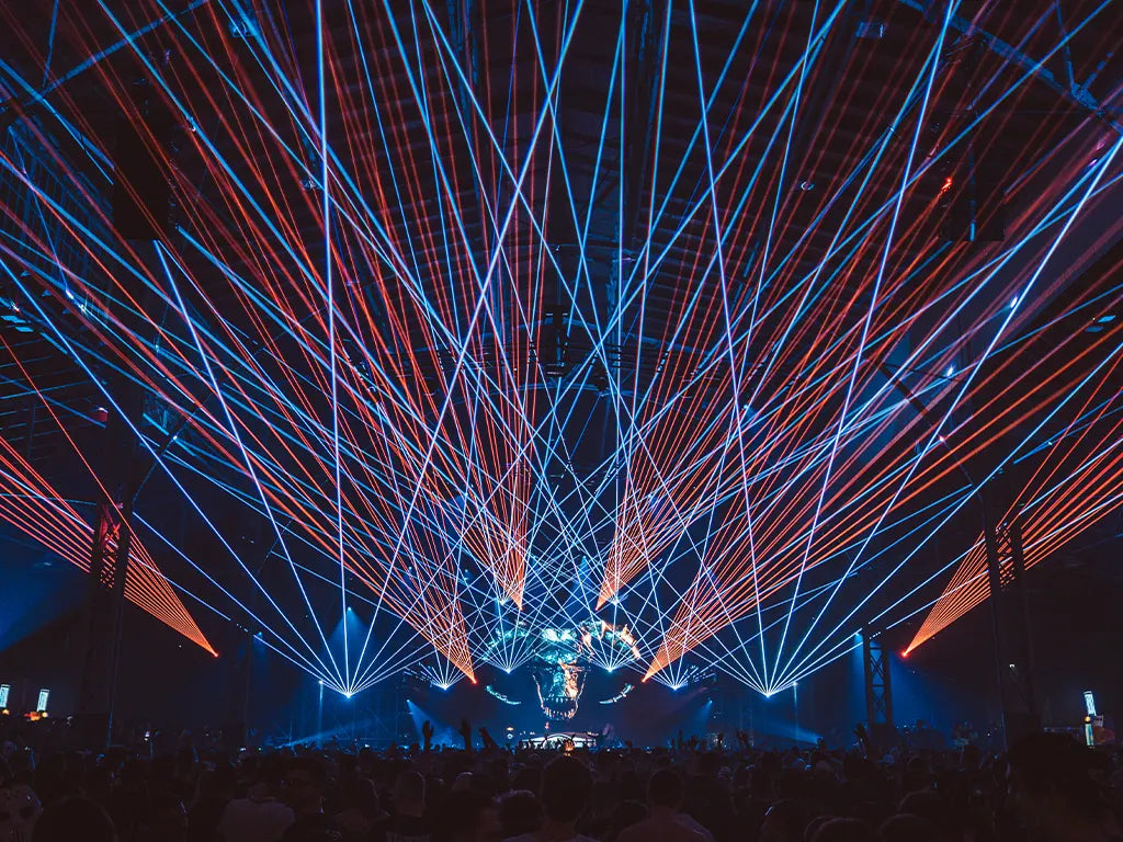 Kvant Clubmax lasers projecting aerial beams overhead crowd